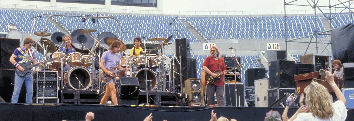 The Grateful Dead performing as a full band at Rich Stadium, Buffalo NY, 1986 True Confessions Tour - concert photography by Chuck Spang