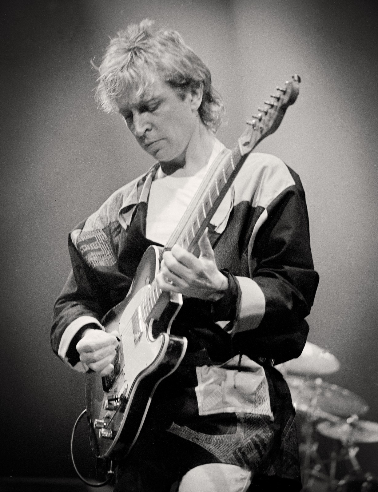 Black and white photo of Andy Summers of The Police playing guitar at Buffalo Memorial Auditorium, 1984 Synchronicity Tour - concert photography by Chuck Spang